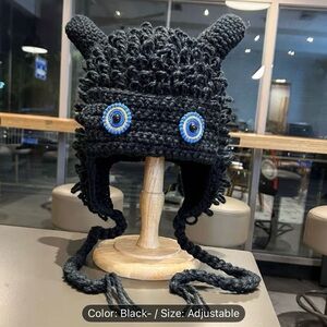 Black Knit Hat with Blue Eyes